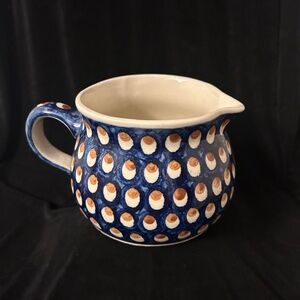 Polish Boleslawiec Pottery blue pitcher in brown and white pattern.
